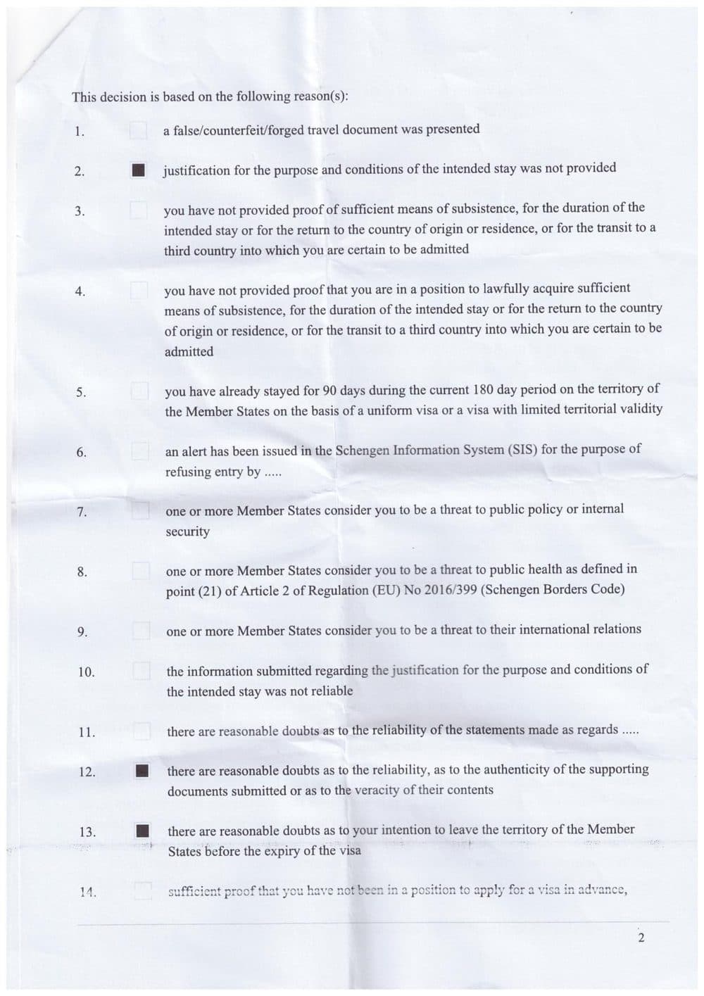 Real Netherlands Schengen visa refusal page showing boxes 2, 12, and 13 ticked.