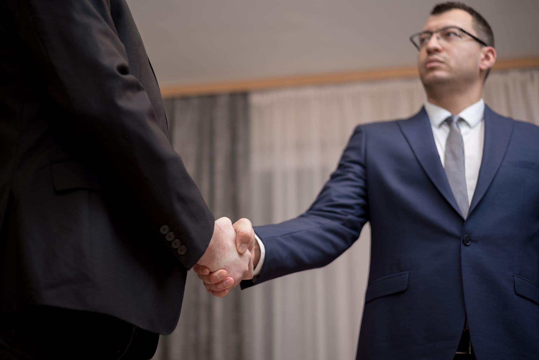 Two business people shaking hands after a meeting